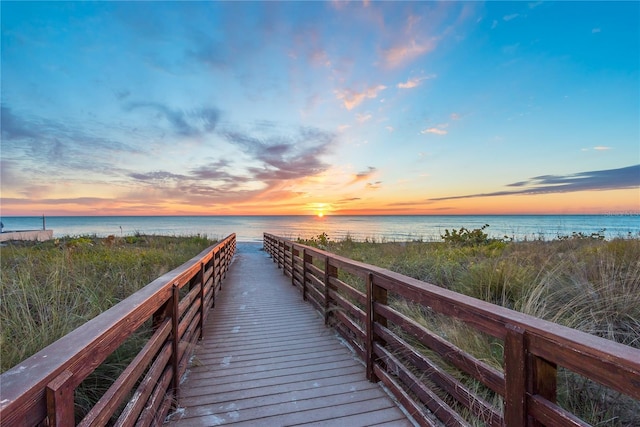 dock area featuring a view of the beach and a water view