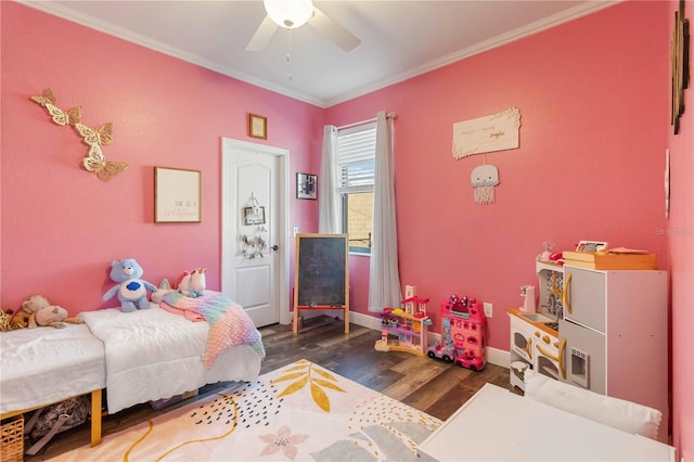 bedroom featuring ceiling fan, dark hardwood / wood-style floors, and ornamental molding