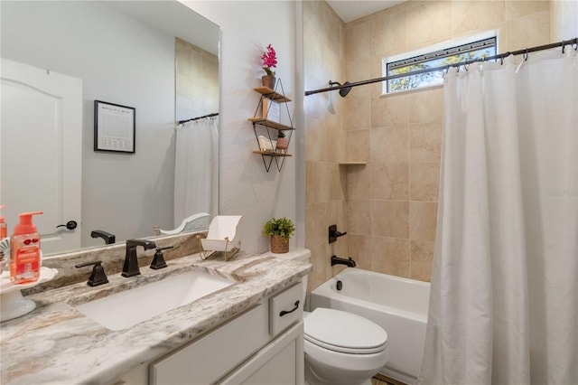 full bathroom with vanity, shower / bath combination with curtain, and toilet