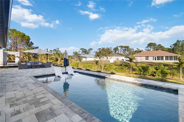 view of pool with a patio area and an outdoor hangout area