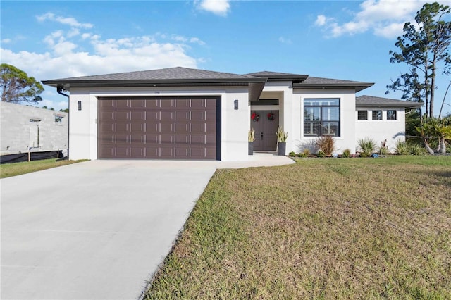 prairie-style house with a garage and a front yard