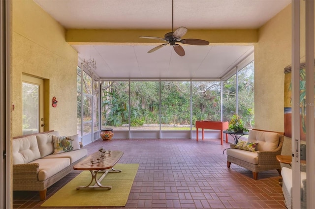 sunroom / solarium featuring ceiling fan