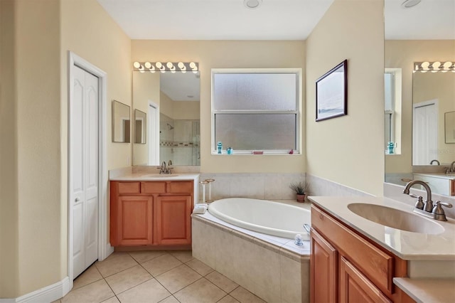 bathroom with vanity, tile patterned floors, and independent shower and bath