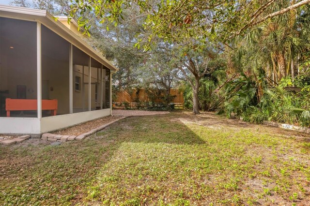 view of yard featuring a sunroom