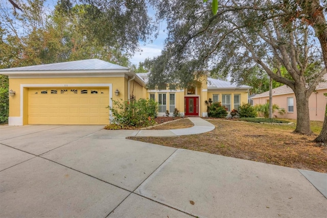 ranch-style home featuring a garage