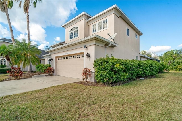 view of front of house with a front yard and a garage