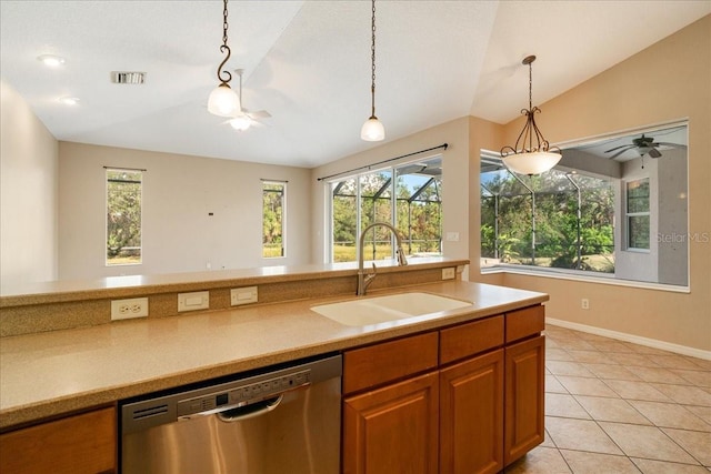 kitchen with plenty of natural light, dishwasher, lofted ceiling, and sink