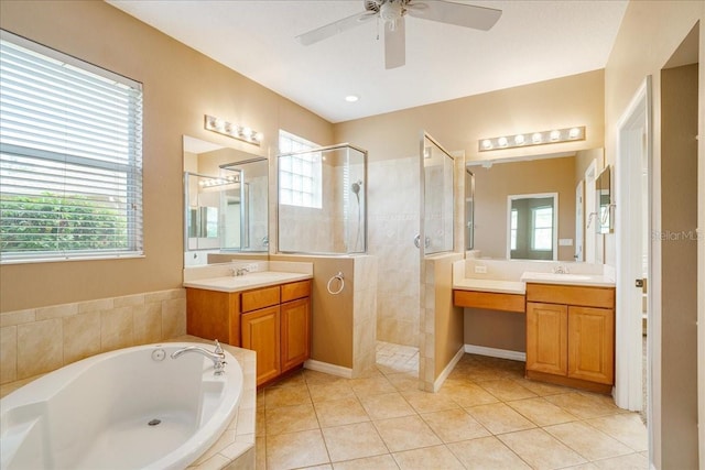 bathroom featuring tile patterned floors, a wealth of natural light, and separate shower and tub