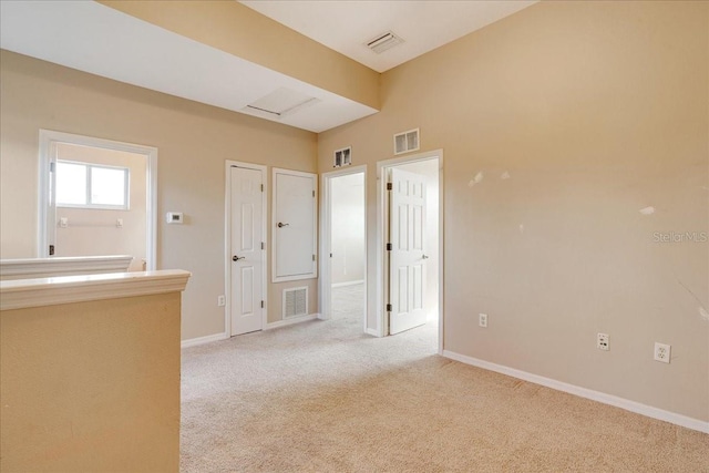 empty room with light colored carpet