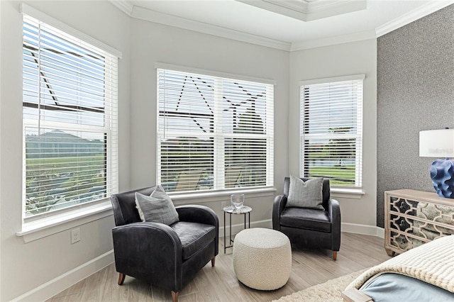 bedroom with light hardwood / wood-style floors, crown molding, and multiple windows