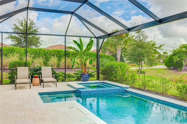 view of swimming pool featuring glass enclosure, a patio area, and an in ground hot tub