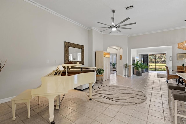 interior space featuring ornamental molding and ceiling fan