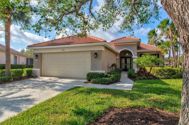 mediterranean / spanish home featuring french doors, a tile roof, stucco siding, an attached garage, and driveway