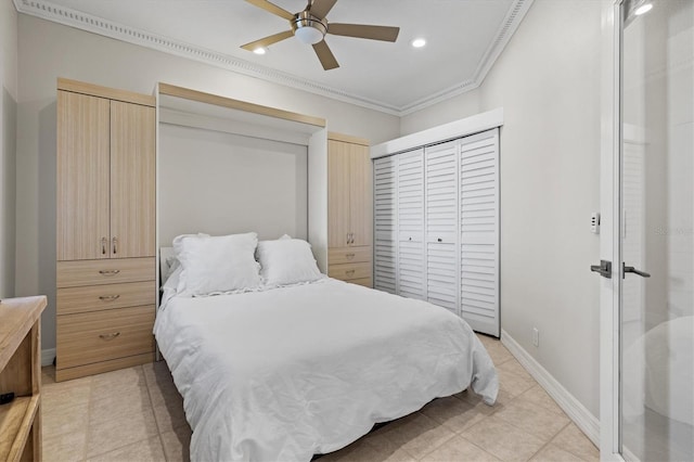 bedroom featuring crown molding, two closets, and ceiling fan