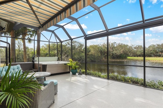 unfurnished sunroom featuring a water view