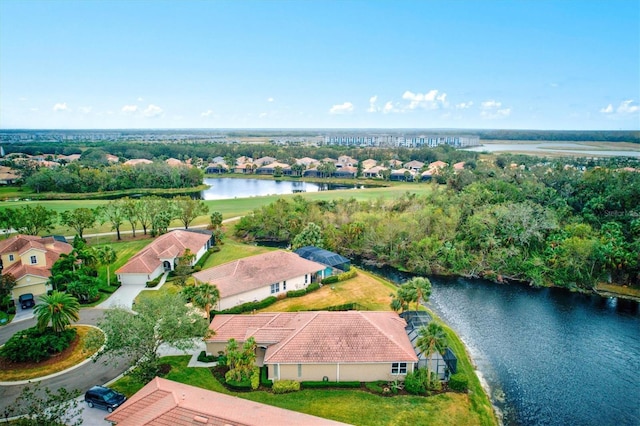 birds eye view of property featuring a water view and a residential view