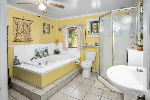 bathroom featuring toilet, tile patterned flooring, and crown molding