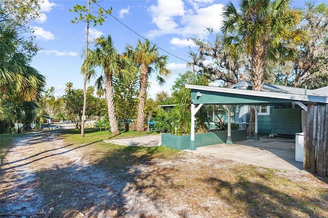 view of yard featuring a carport