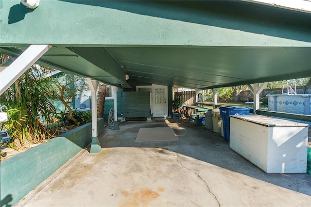 view of patio / terrace featuring a carport