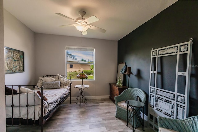 bedroom featuring hardwood / wood-style flooring and ceiling fan