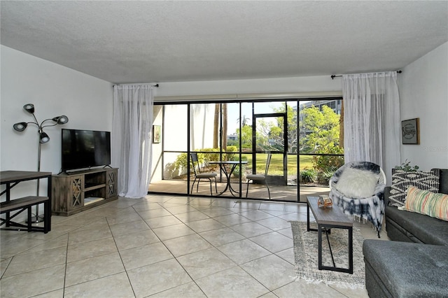 living room with light tile patterned floors and a textured ceiling