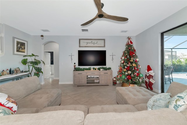 tiled living room featuring ceiling fan