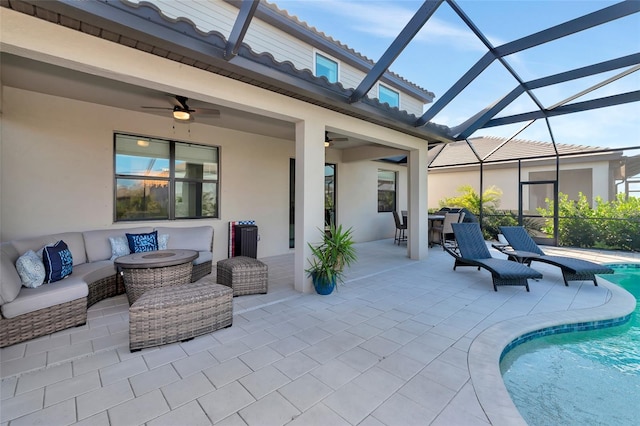 view of patio with ceiling fan, a lanai, and an outdoor living space