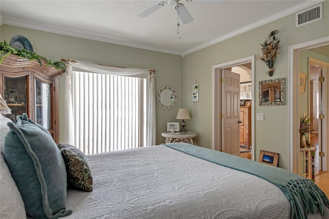 bedroom with crown molding and ceiling fan