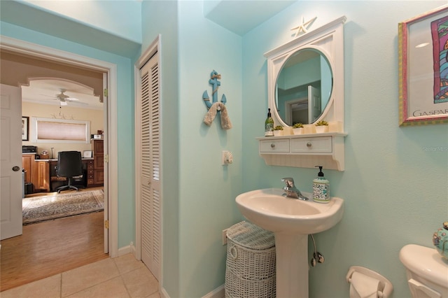 bathroom featuring tile patterned floors, ceiling fan, and toilet