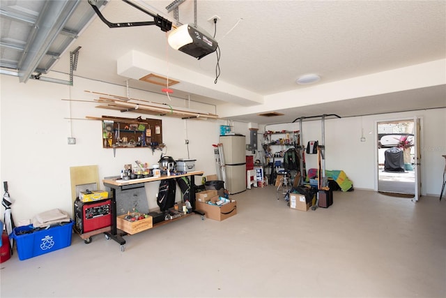 garage with a garage door opener, electric panel, and refrigerator