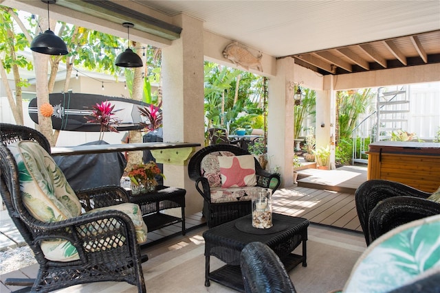 wooden deck with outdoor lounge area and a hot tub