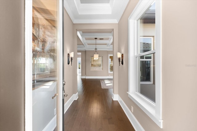 corridor with beamed ceiling, ornamental molding, dark wood-type flooring, and coffered ceiling