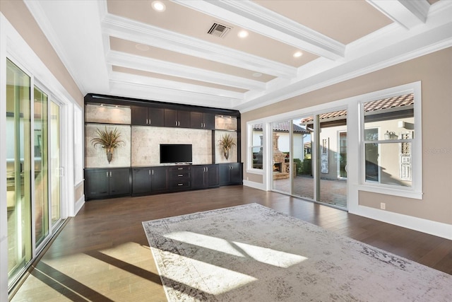 unfurnished living room with dark hardwood / wood-style floors, a healthy amount of sunlight, and ornamental molding