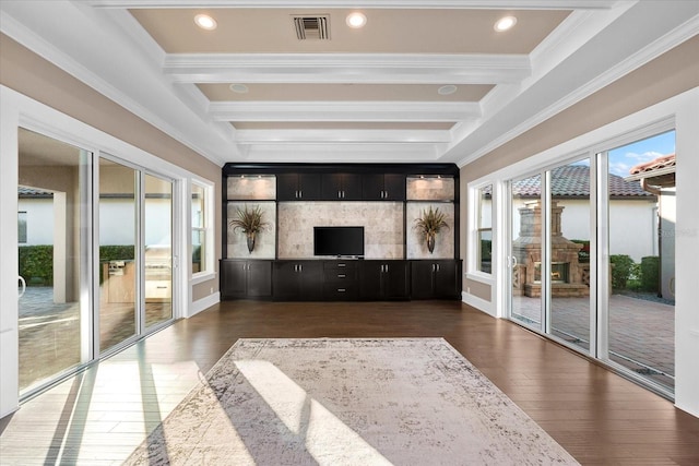 unfurnished sunroom featuring a healthy amount of sunlight and beam ceiling