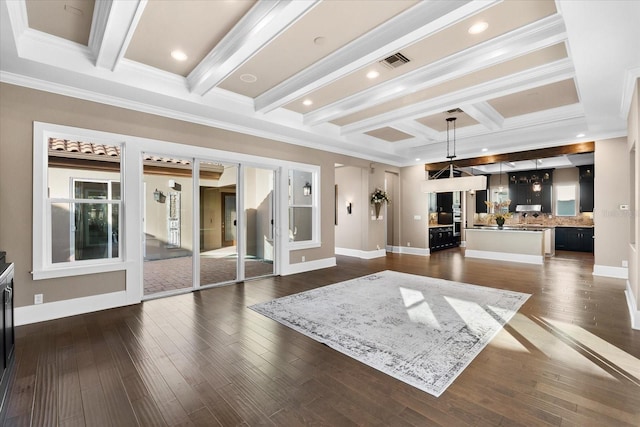 unfurnished living room with beamed ceiling, dark hardwood / wood-style flooring, and crown molding