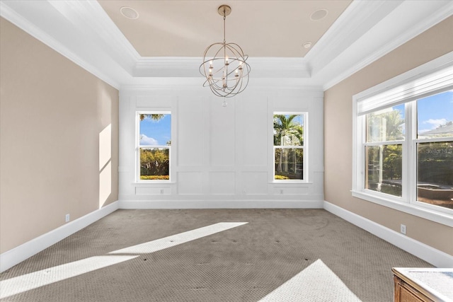 unfurnished dining area featuring carpet, a notable chandelier, and ornamental molding