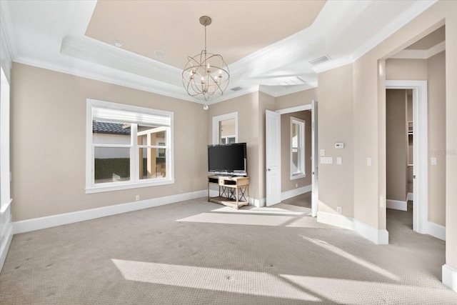 unfurnished living room featuring a tray ceiling, light carpet, an inviting chandelier, and ornamental molding