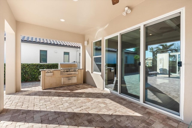 view of patio featuring area for grilling and exterior kitchen