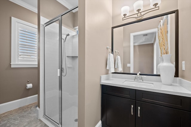 bathroom with vanity, a shower with door, and ornamental molding