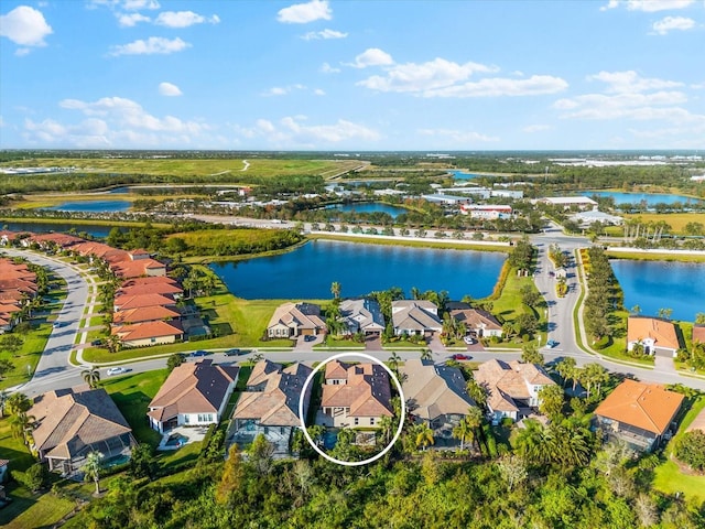 bird's eye view with a water view