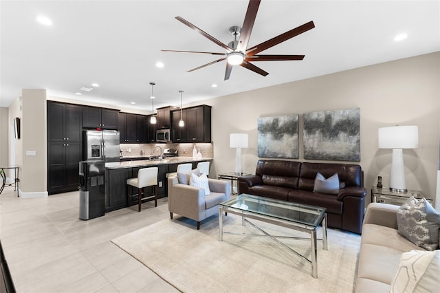 living room with sink and ceiling fan