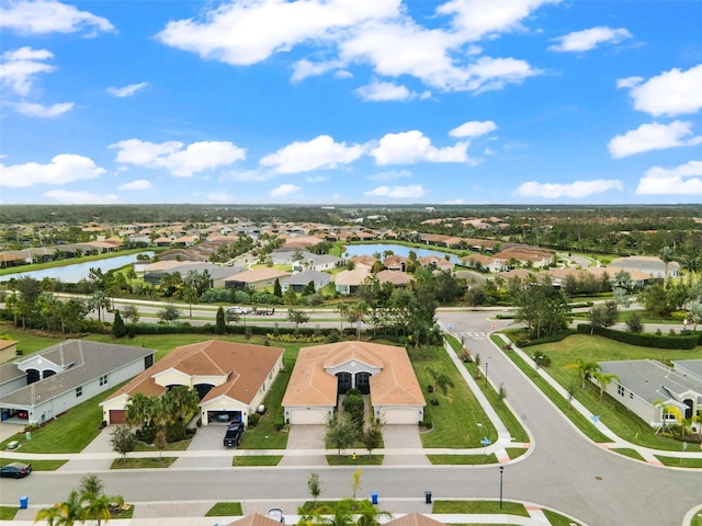 drone / aerial view with a water view