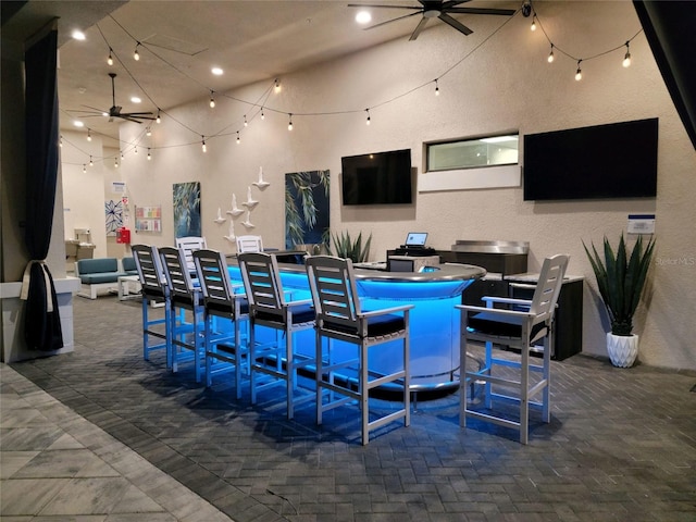 interior space featuring ceiling fan