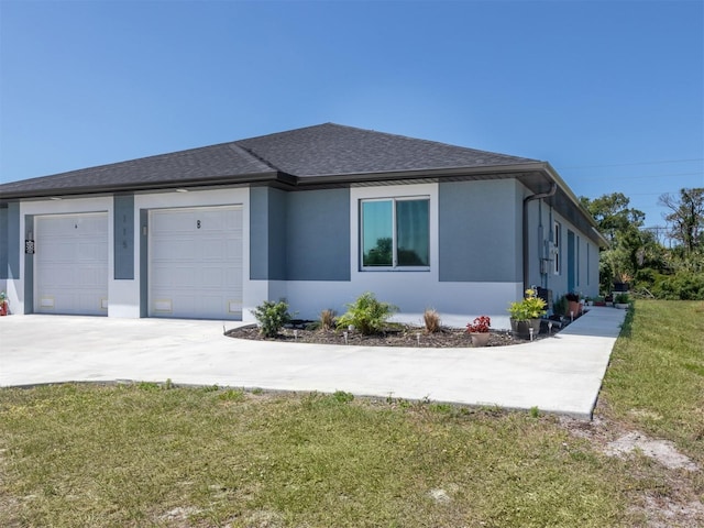 view of front of house with a garage and a front yard