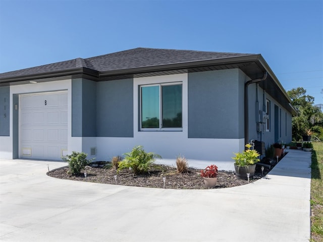 view of side of home with a garage