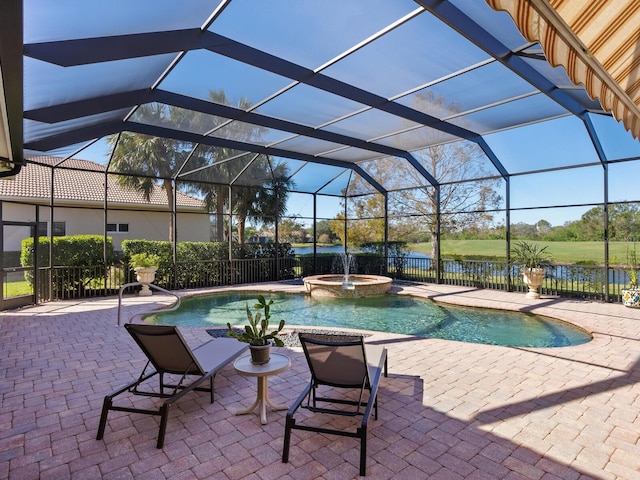 view of swimming pool featuring an in ground hot tub, a water view, glass enclosure, and a patio area