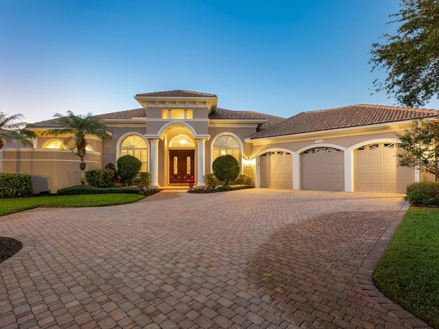 mediterranean / spanish-style home featuring a garage