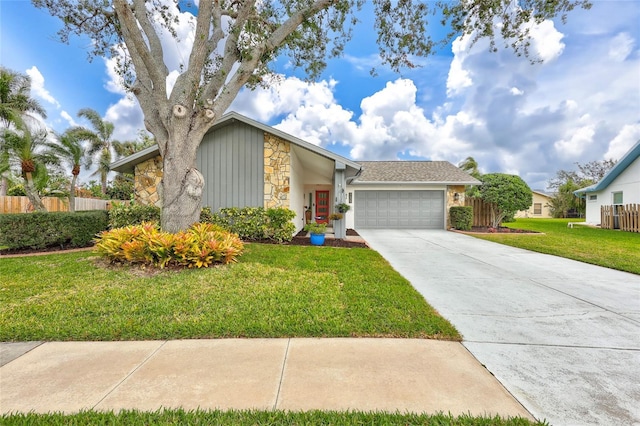 view of front of house with a front lawn and a garage