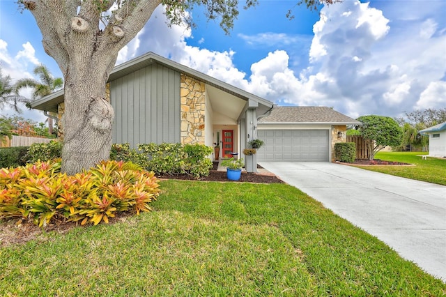 view of front of home featuring a garage and a front lawn