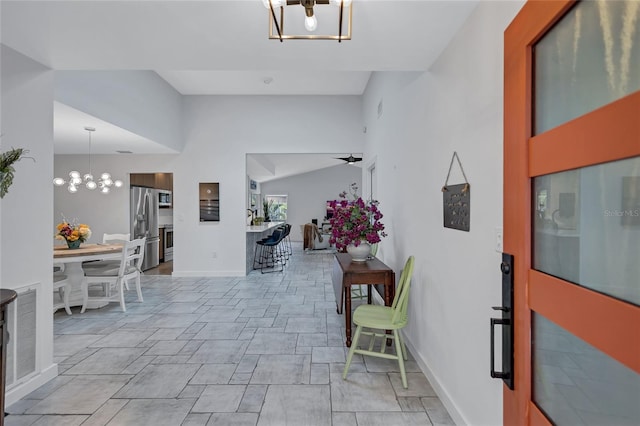 foyer entrance featuring an inviting chandelier